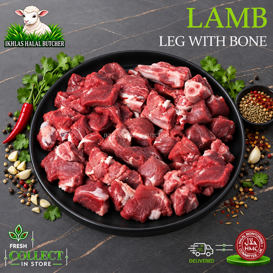 Halal lamb leg diced, on the bone, curry cut, with parsley and chilli, on a black plate, Ikhlas Halal Butcher, Bradford
