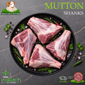 Four raw mutton shanks arranged on a black plate with herbs and diced onion, set on a dark stone surface. Large text reads 'MUTTON SHANKS' and the Ikhlas Halal Butchery logo appears in the top left.